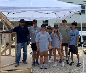 This is a photo of the HPHS Maps students and playhouse builders